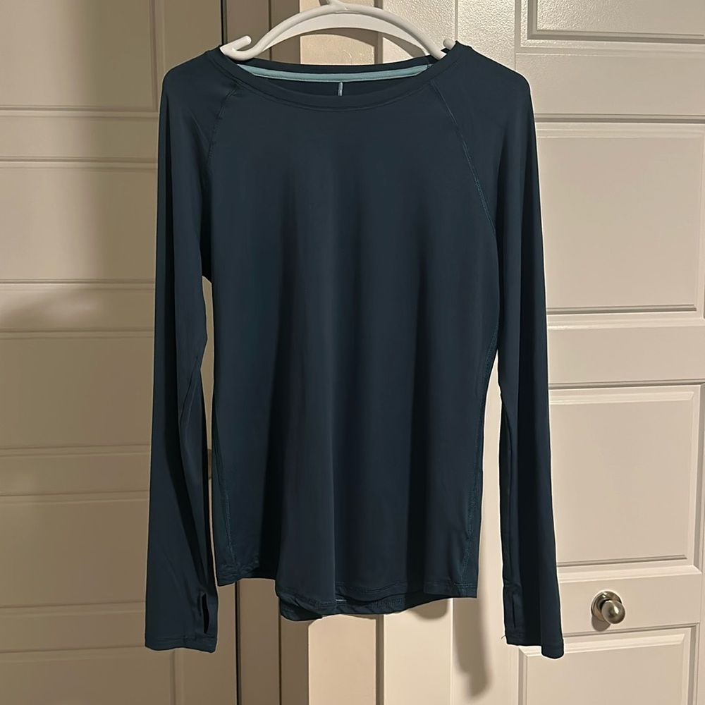 Champion Size M spandex or sport tec workout top. Teal in color.